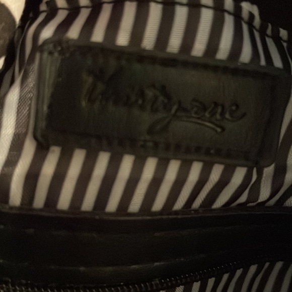 Brand new Thirty- one purse. Black and white swirl design. Several zippers. - Picture 4 of 6